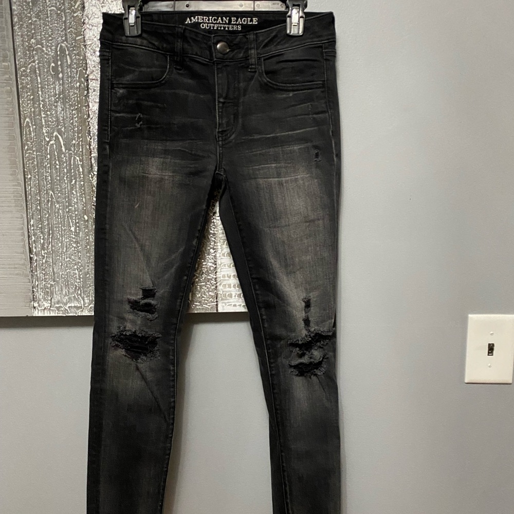 Faded black to grey skinny ripped jeans